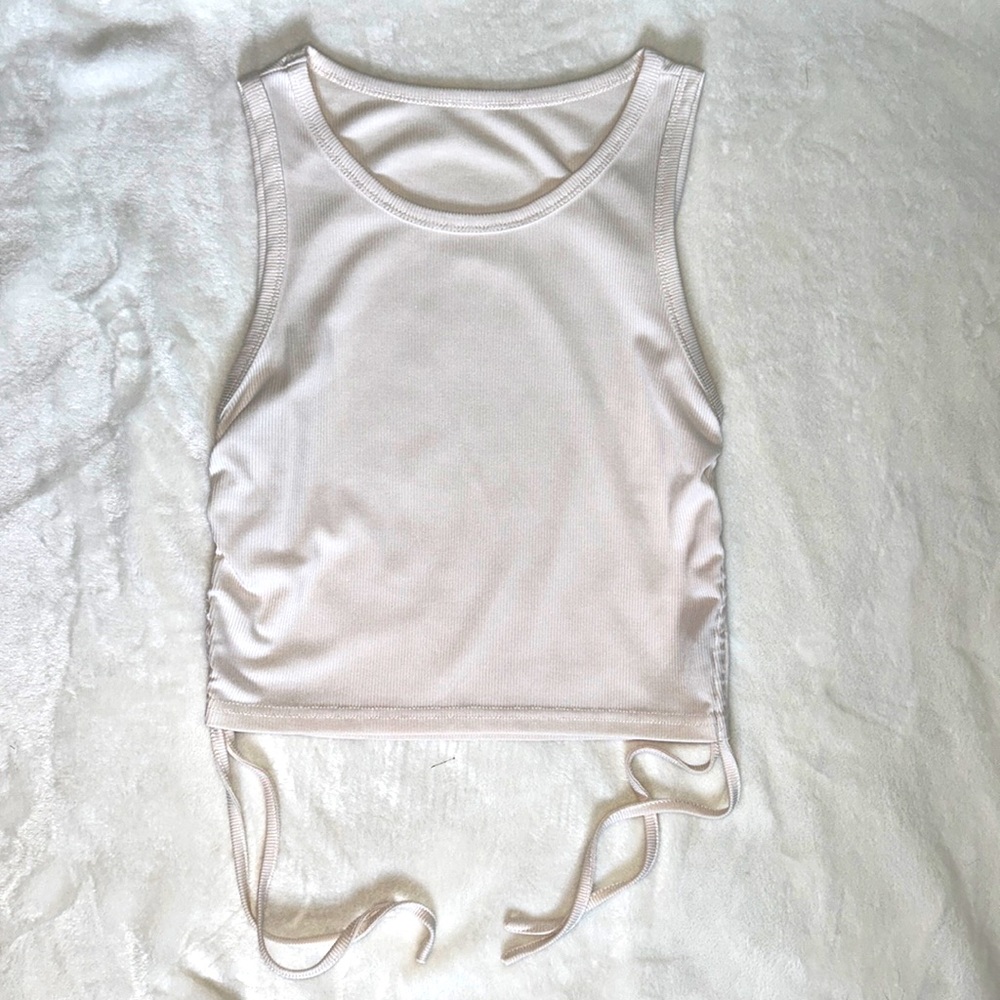 White cropped tank top with adjustable sides. Size medium.